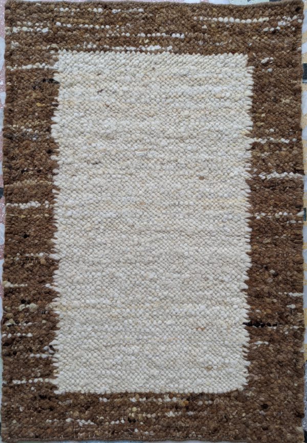 Handcrafted cotton rug with border