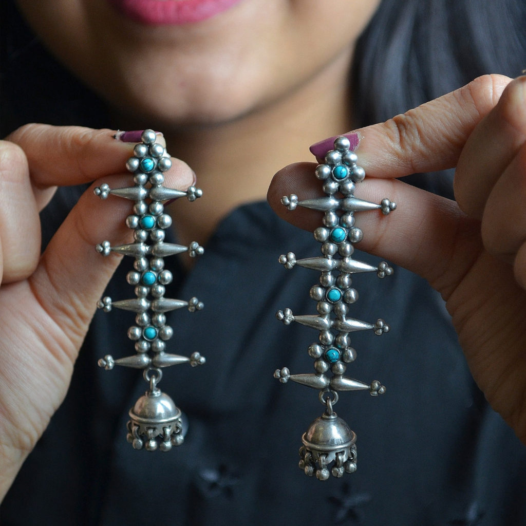 Fish bone shaped danglers | Six petal flower with green pearl silver earring