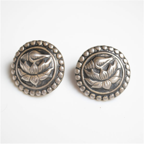 Silver stud earring with lotus and shell design