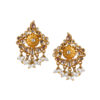 The carefully constructed stud earrings with valuable stones and pearls are made by arranging several stones surrounded by pearls and hanging beads.